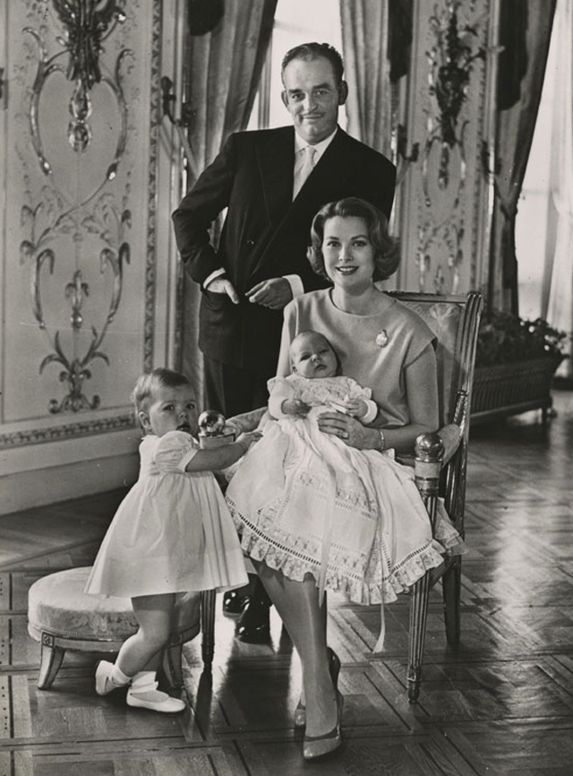 Prince Rainier of Monaco holding his daughter Caroline, while his wife Grace holds their baby son Albert, 1960